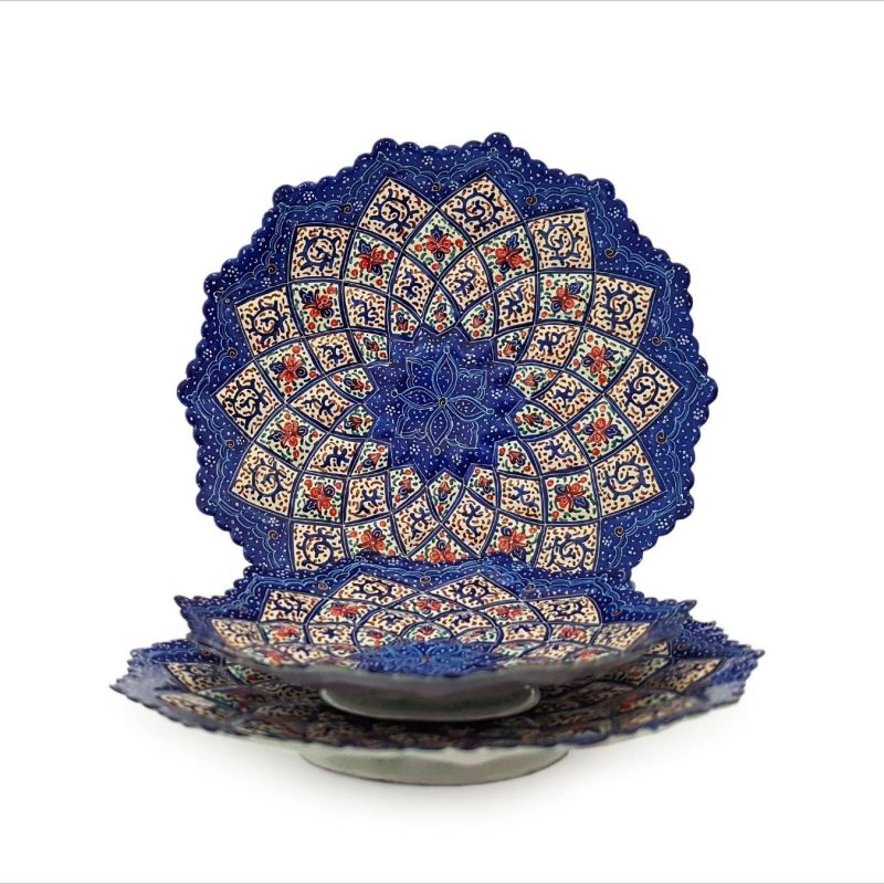 A trio of handcrafted Minakari plates displaying intricate Persian arabesque and floral patterns in an array of vibrant colors.