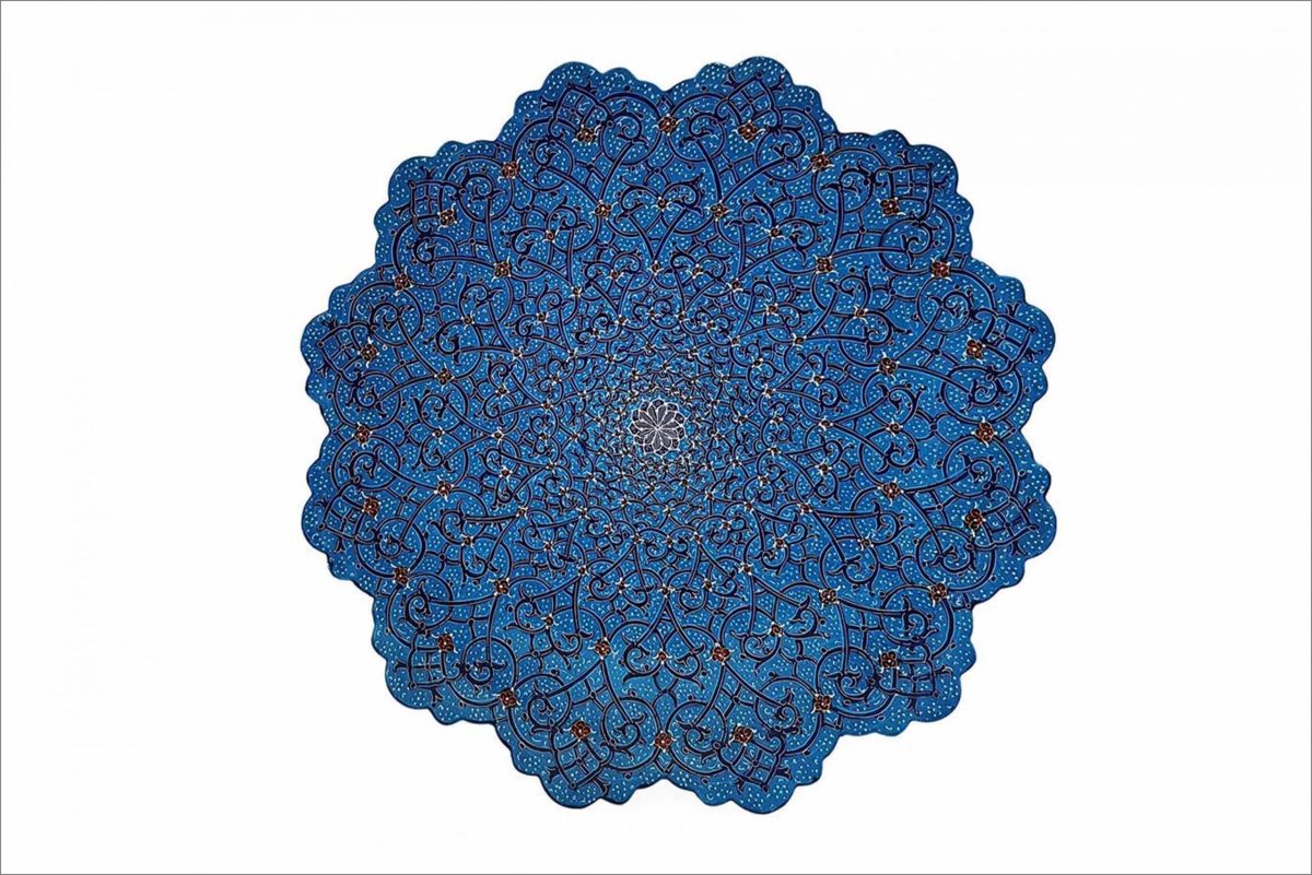 A striking Handmade Persian Enamel Plate in a captivating azure hue, adorned with intricate plant and curvilinear motifs.