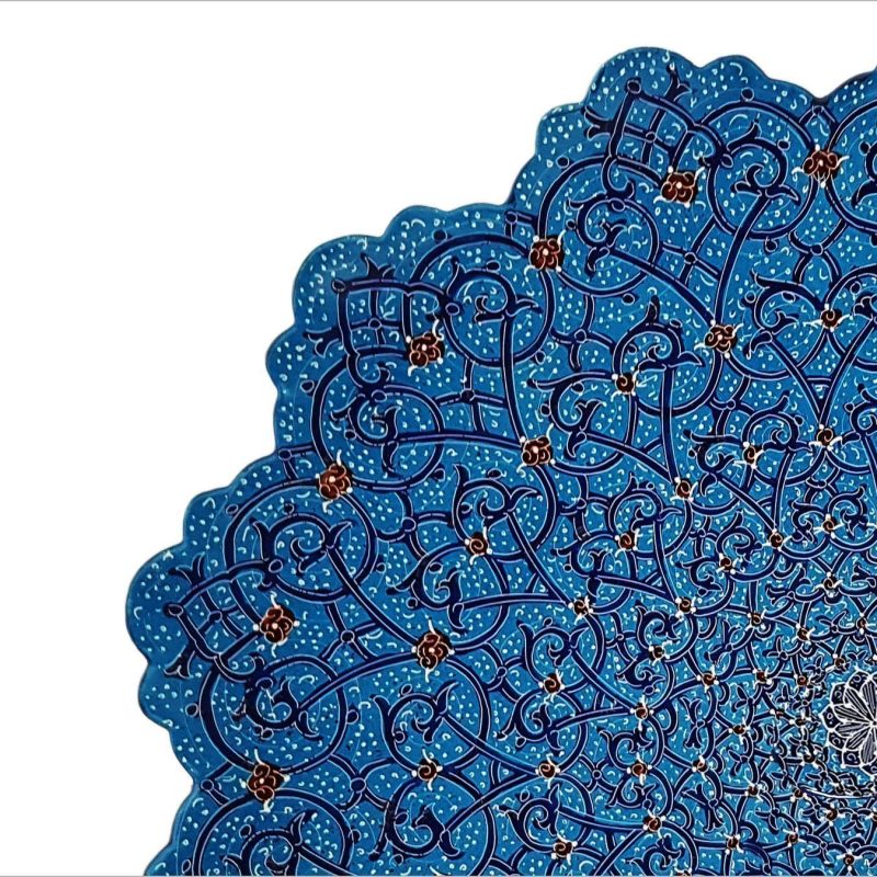 A striking Handmade Persian Enamel Plate in a captivating azure hue, adorned with intricate plant and curvilinear motifs.