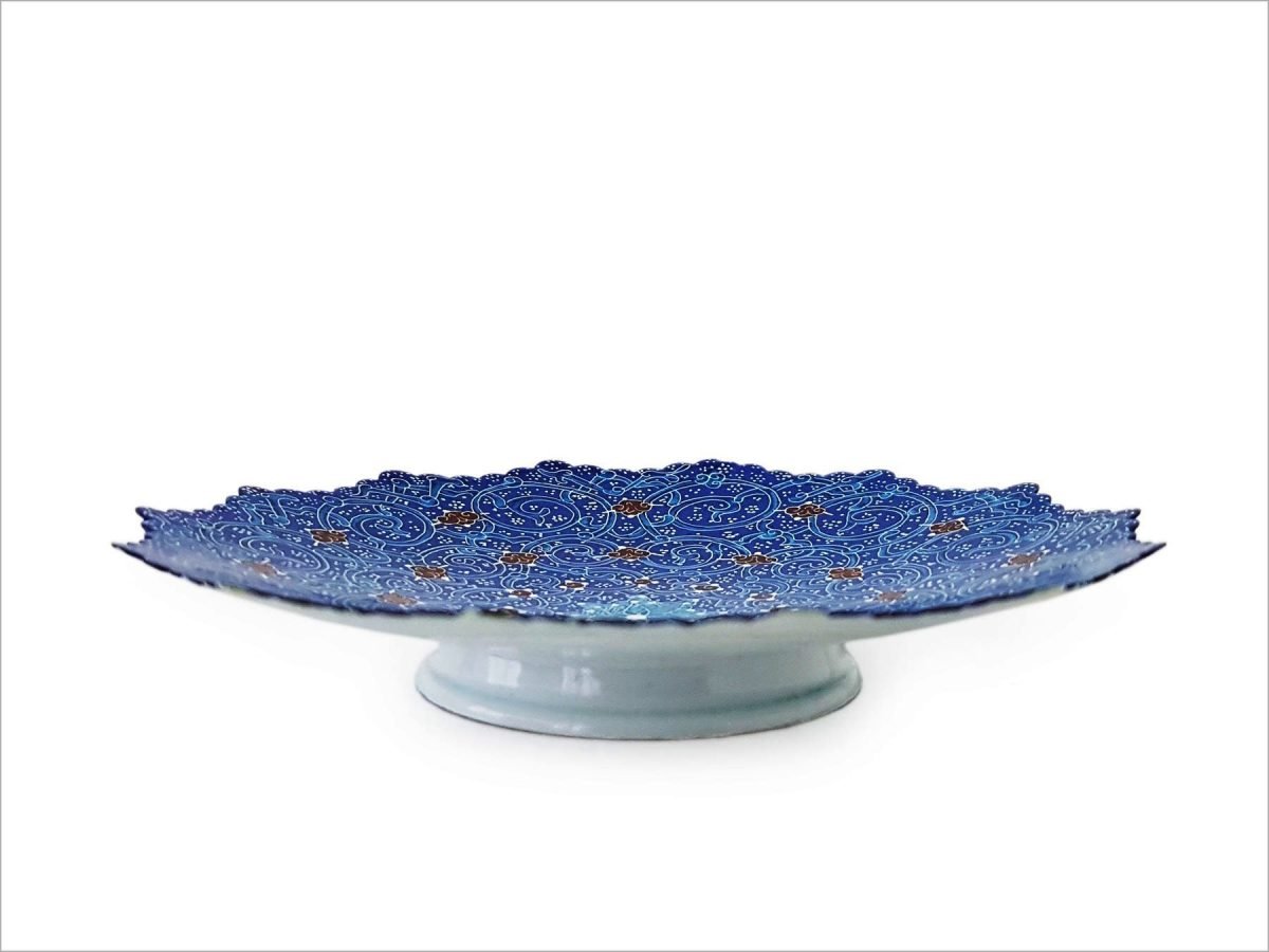 Set of three handcrafted Minakari plates in varying sizes, each adorned with intricate azure blue arabesque patterns.