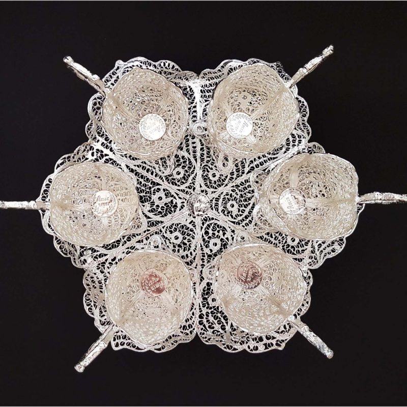 Silver teaware set showcasing intricate Persian designs by Craftestan