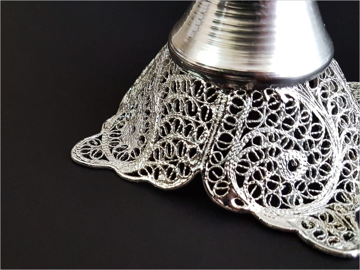 Craftestan's decorative vase showcasing intricate silver-coated filigree, embodying Isfahani elegance.