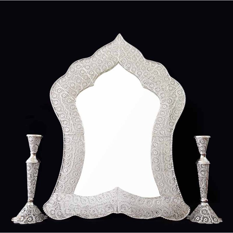 Handmade Persian mirror with intricate silver-coated copper filigree patterns.