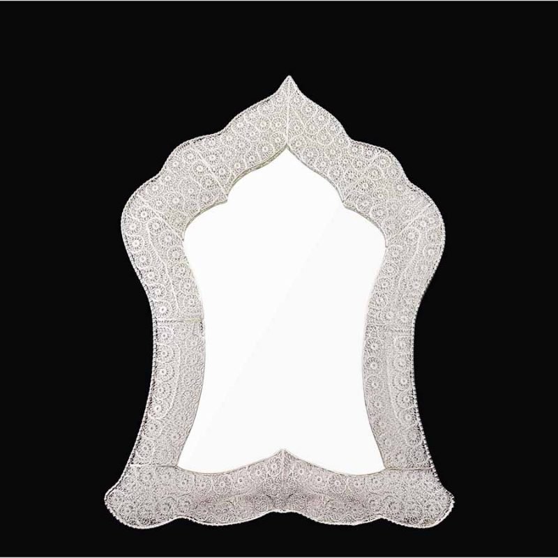 Handmade Persian mirror with intricate silver-coated copper filigree patterns.