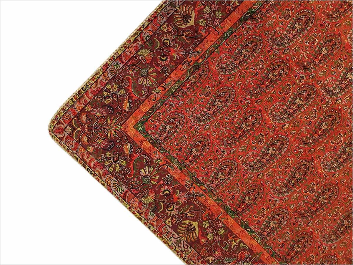 Quality Termeh tablecloth in a rich ruby colour, showcasing the iconic Persian paisley pattern.