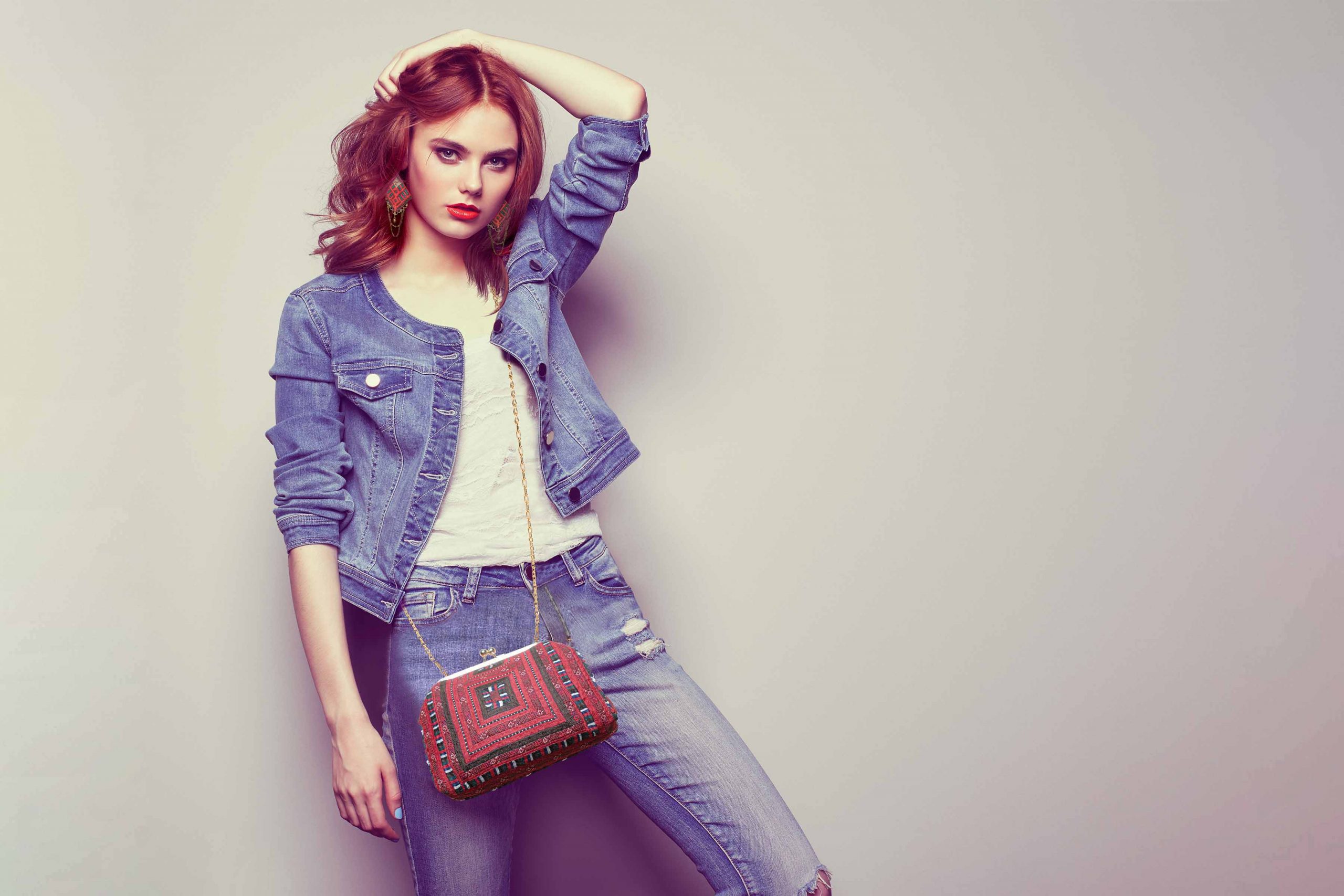 Baluchi Embroidered Handbag featuring a multi-coloured Kilim pattern, skillfully crafted by dedicated Baluchi female artisans.