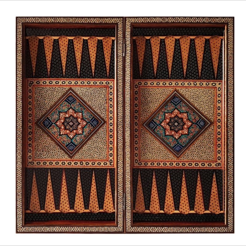 This exquisite Persian marquetry backgammon is a true work of art. Measuring 50 cm in length and width, it boasts a rich combination of brown, gold, and black tones. The intricate oriental geometric pattern adds to its sophisticated charm, making it not only a functional game board, but also a stunning decorative piece