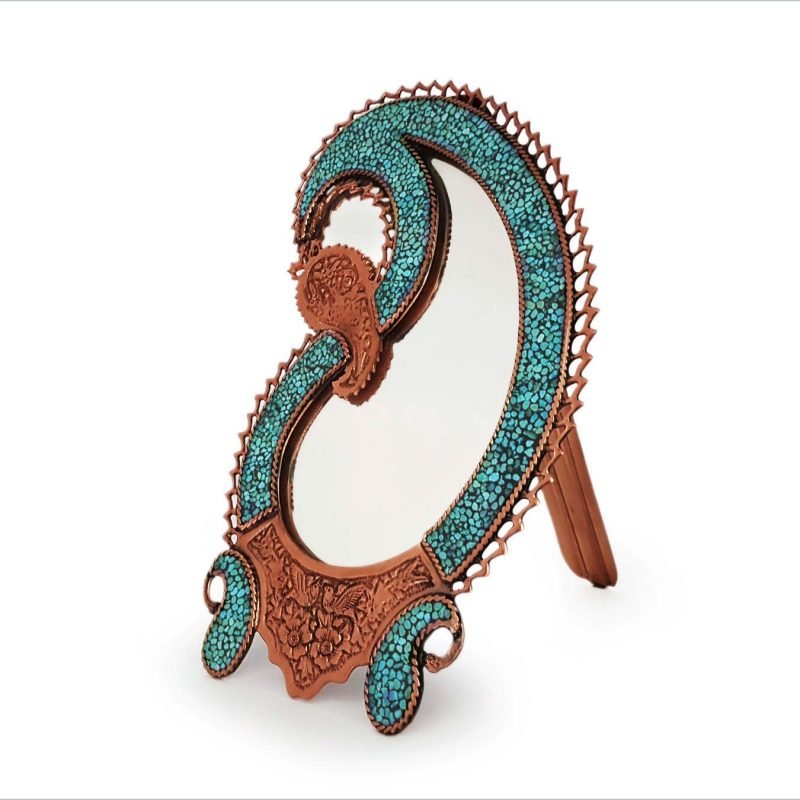Isfahani desk mirror with 'Boteh' or paisley design, adorned with Nishapour turquoise, reflecting Persia's artistic legacy and symbolism.