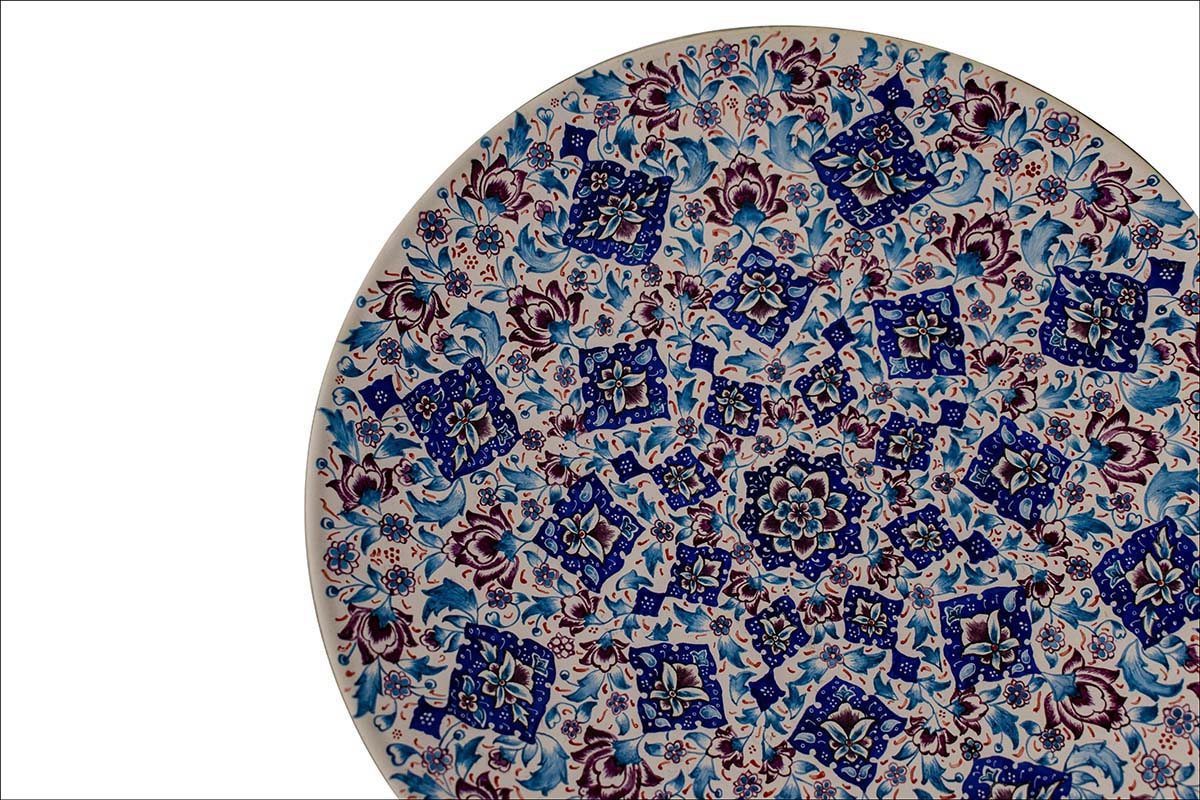 Hand-painted White Minakari Decorative Plate adorned with Persian floral and foliate patterns, echoing the grandeur of Persian craftsmanship.