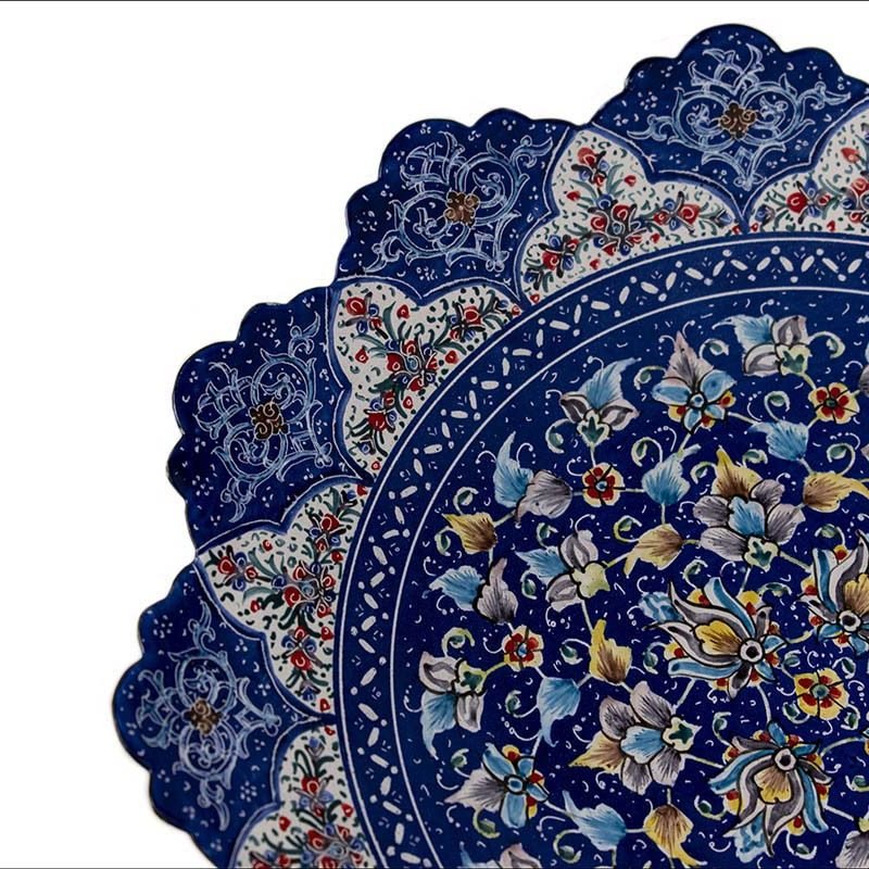 A 25cm Handmade Minakari Decorative Plate, showcasing a dense floral and foliate pattern on a blue backdrop, reminiscent of a Persian garden.