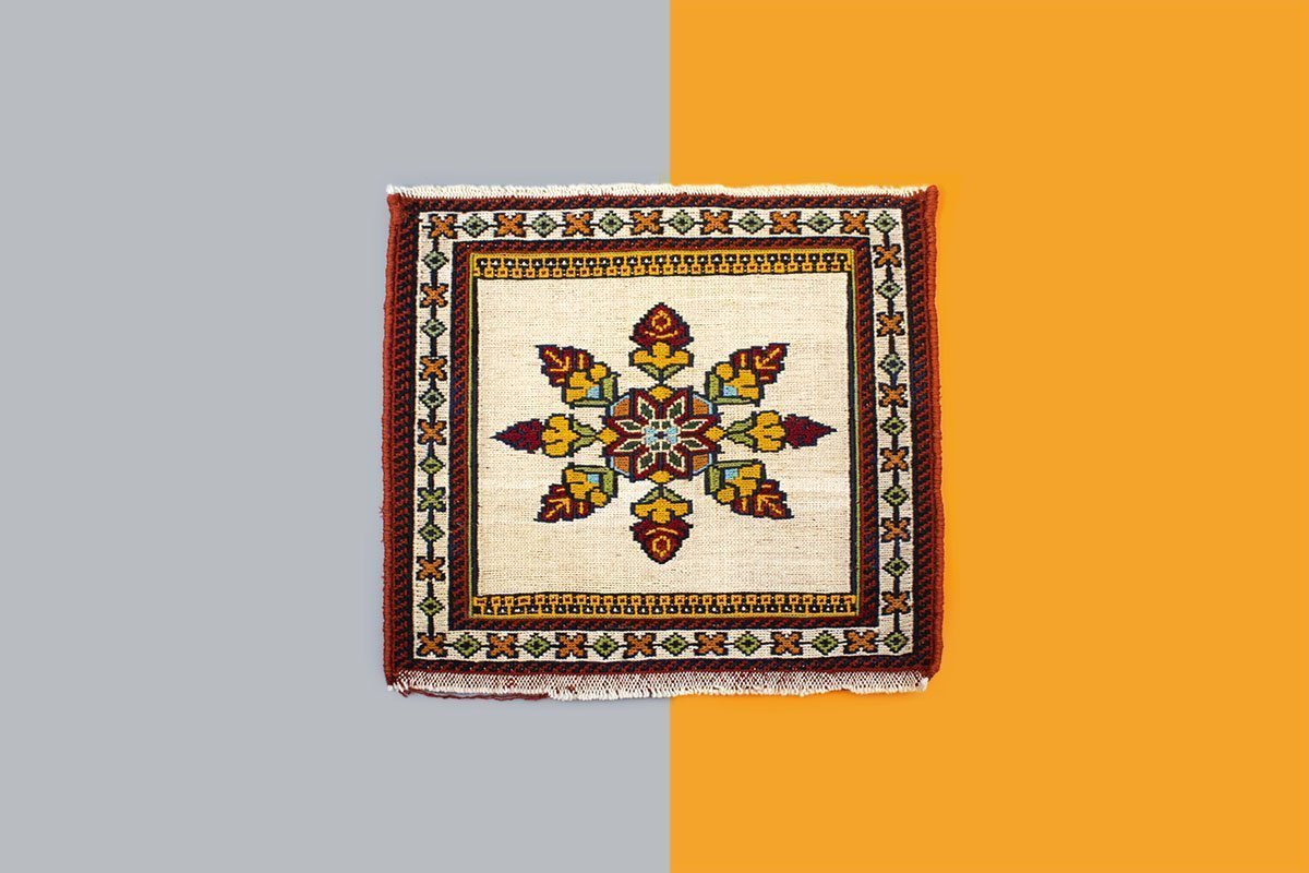 The Miniature Persian Kilim Is Hand Knotted Completely And Is Made Of Copper. The Length And The Width Of The Kilim Is 30cm. The Pattern Features The Iconic Geometric Floral Persian Motifs.
