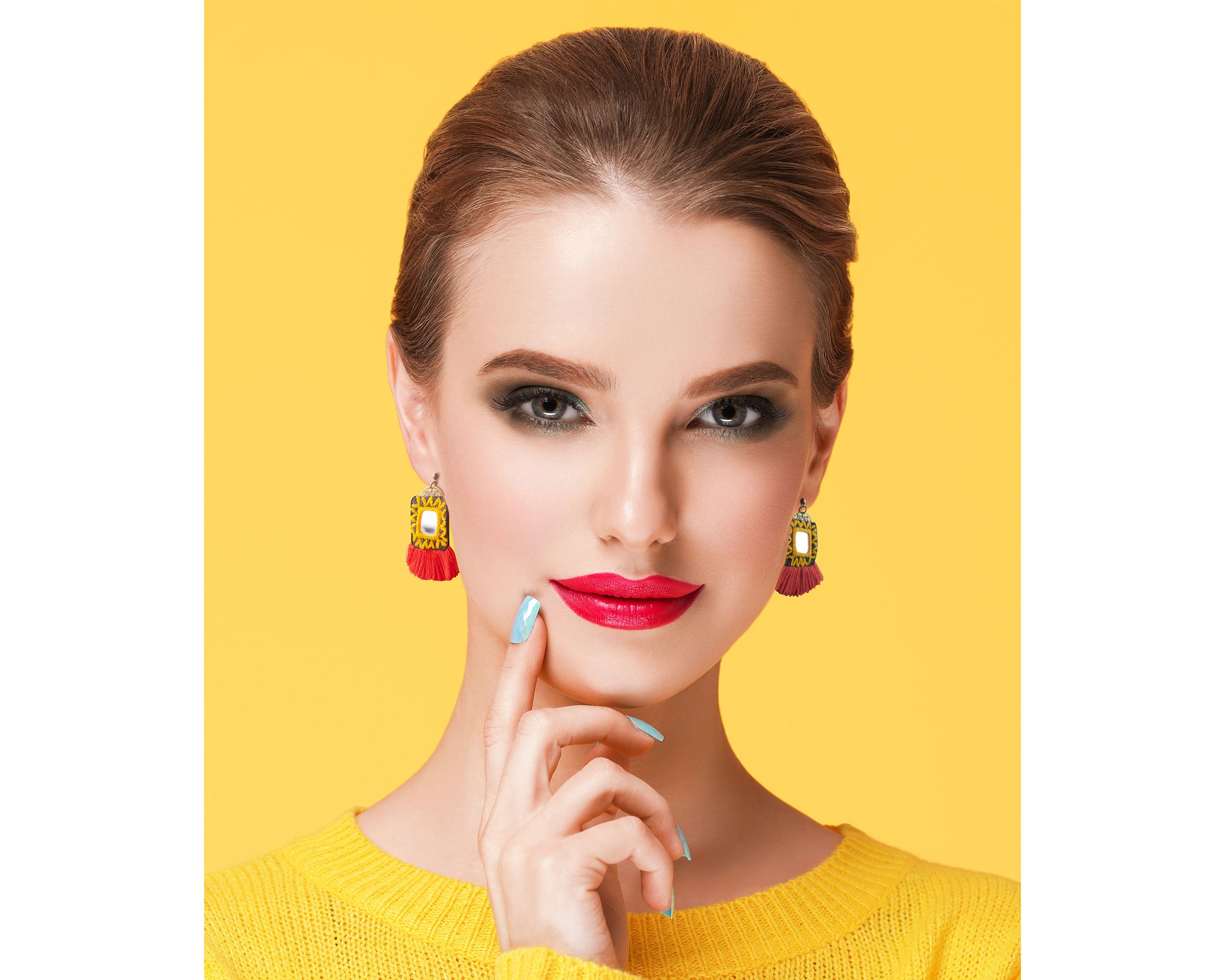 A pair of Baluchi embroidered mirror earrings featuring intricate embroidery and stunning mirrors, handcrafted by talented Baluchi female artisans.