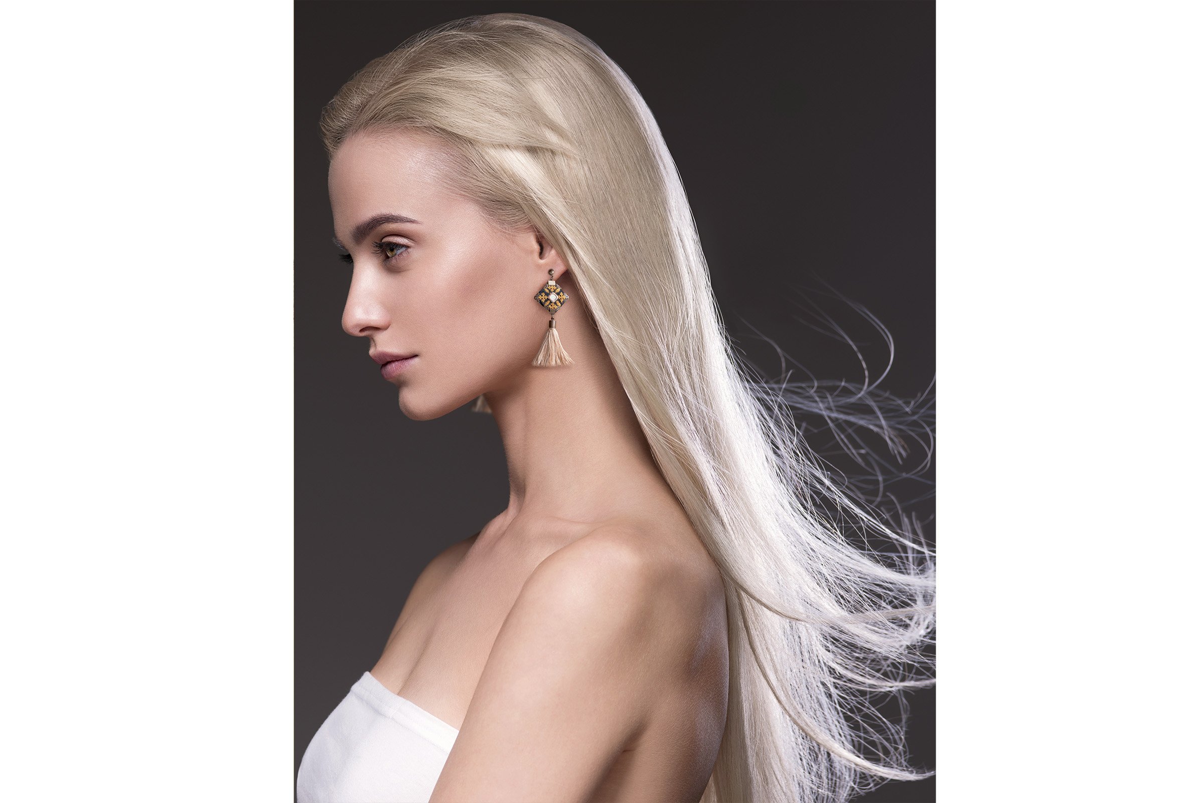 Elegant hand-embroidered Baluchi accessory set featuring a pair of earrings and a matching bracelet with intricate designs