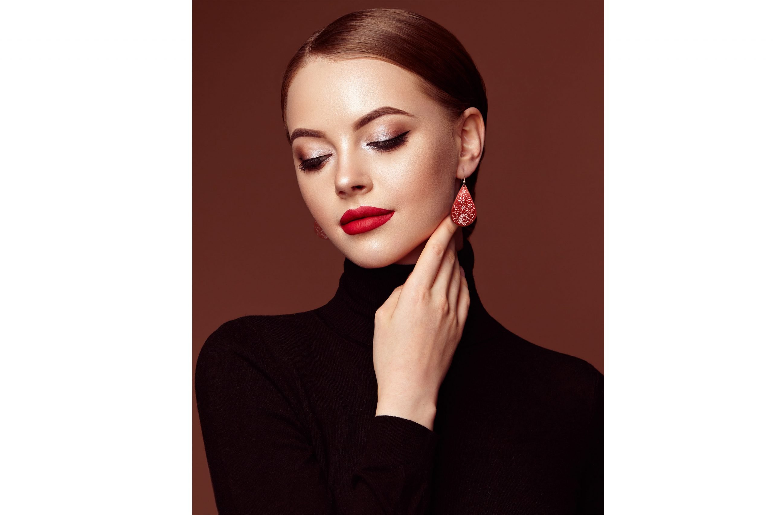 Beautiful model wearing Persian enamel dangle earrings, expertly hand-painted