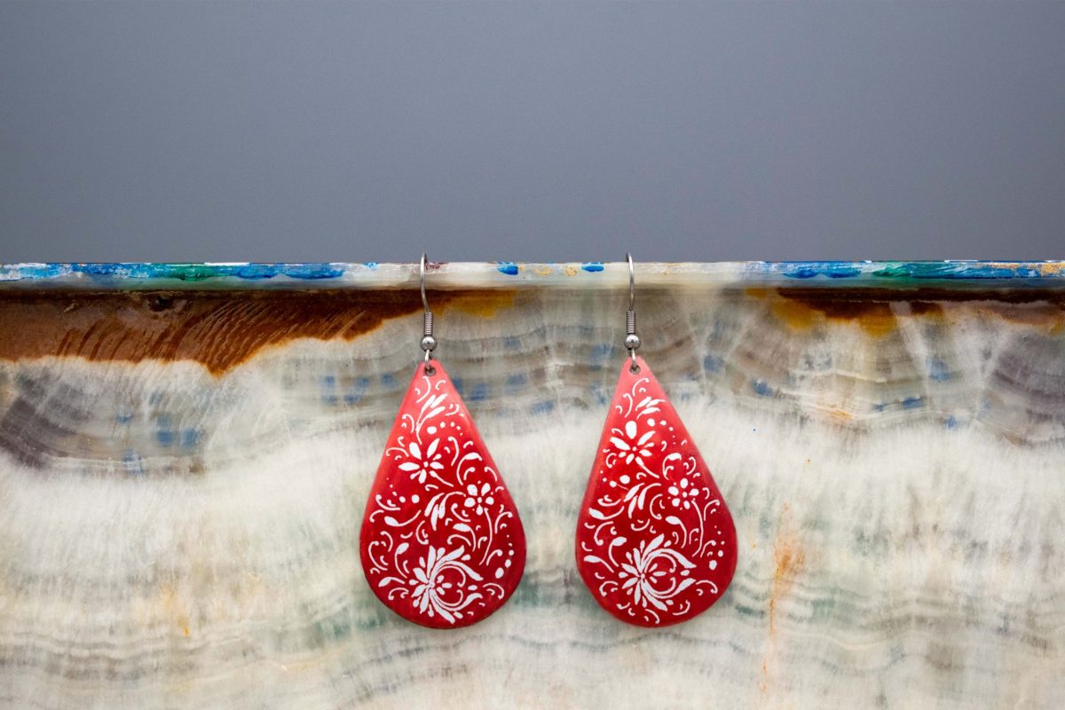 Persian enamel dangle earrings with Islimi and biomorphic patterns, skillfully hand-painted in crimson by freelance Persian female artisans.