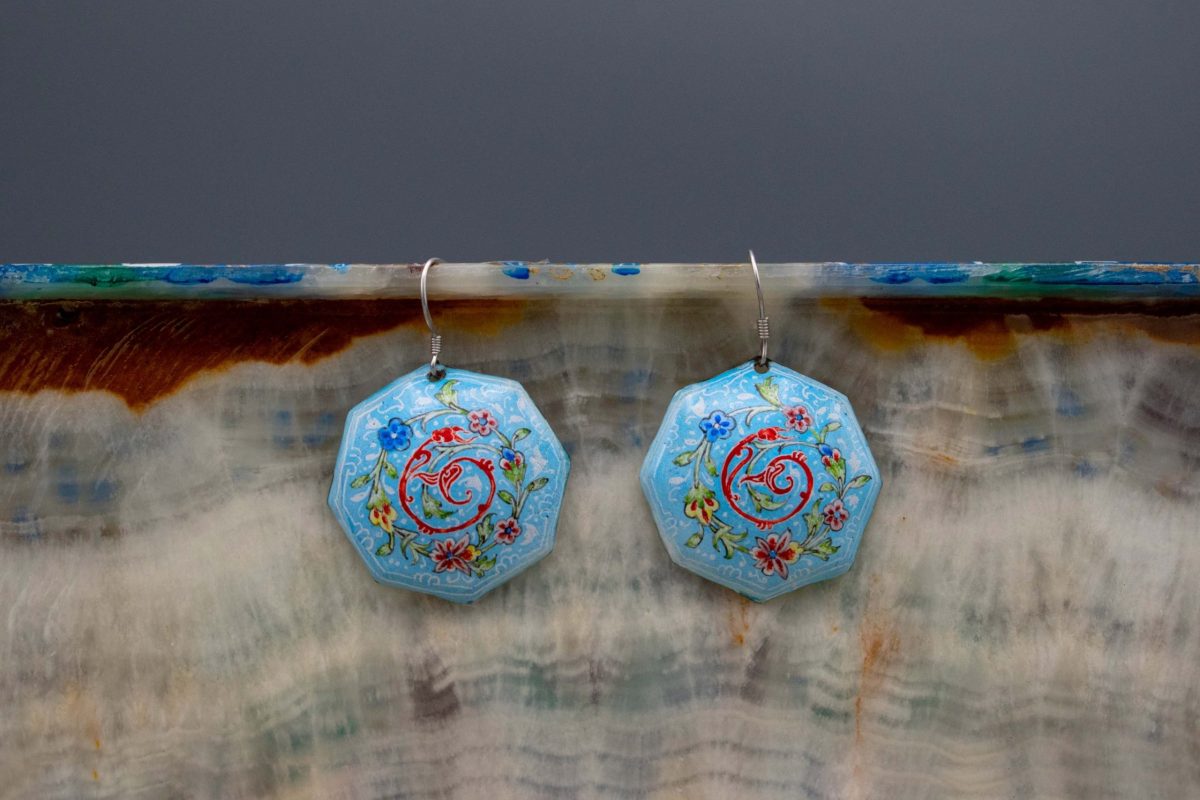 Enamel watercolour painting earrings with Persian garden design, skillfully hand-painted by a master artisan. Made of enamelled copper with titanium hooks. Each earring measures 4.5cm in height. Sky blue colour.