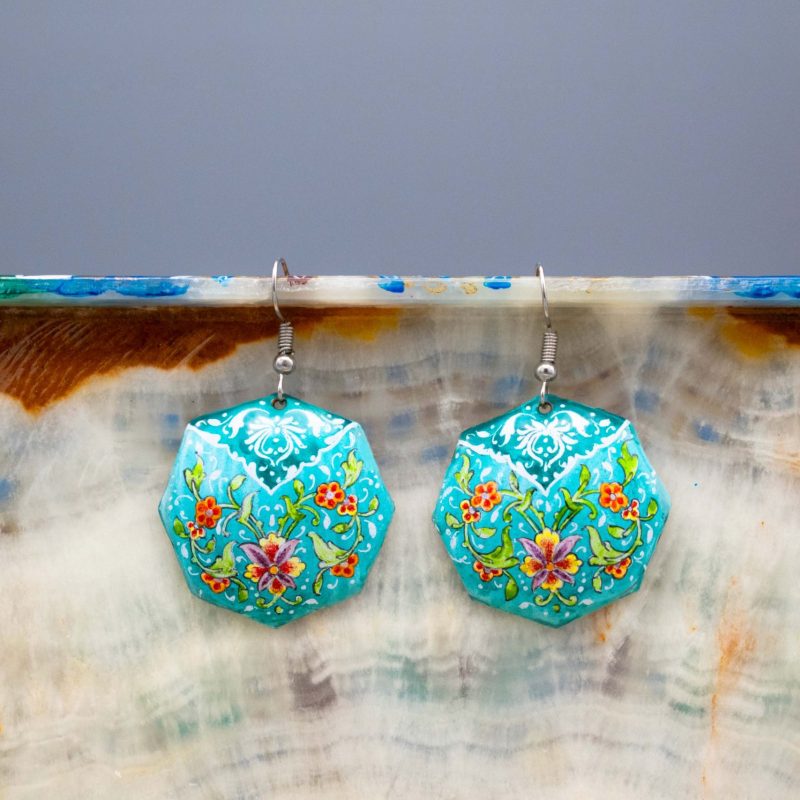 A pair of viridescent enamel earrings with a delicate foliage design, made of enamelled copper and silver hooks.