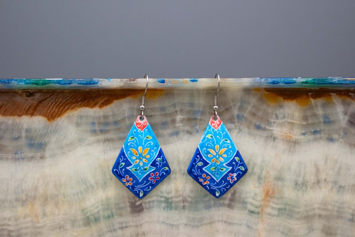 Hand-painted enamel dangle earring featuring Persian garden design on enamelled copper body and silver hook.