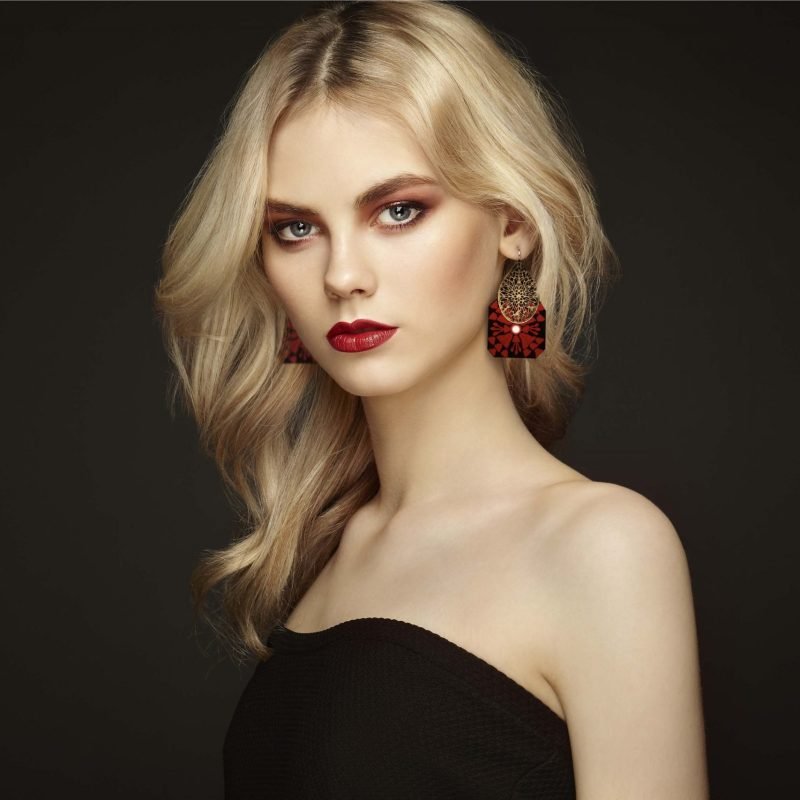 Elegant hand-embroidered Baluchi Bohemian Earrings in black and red, showcasing intricate floral patterns and copper details.