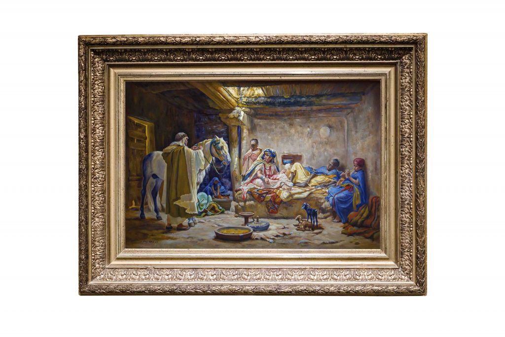  A cozy, sunlit interior of a traditional North African home with mud walls, furnished with rich textiles, pottery, and baskets.