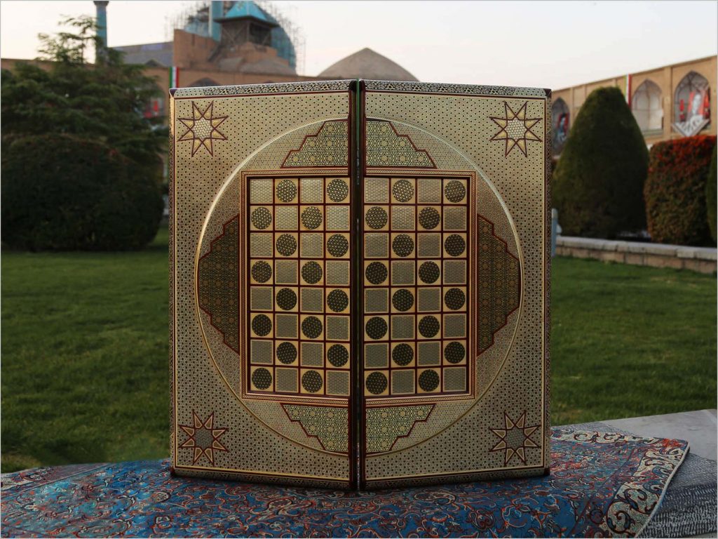 Elegant golden Persian marquetry backgammon and chess board, handcrafted with traditional techniques for the ultimate luxury gaming experience. History of Board Games
