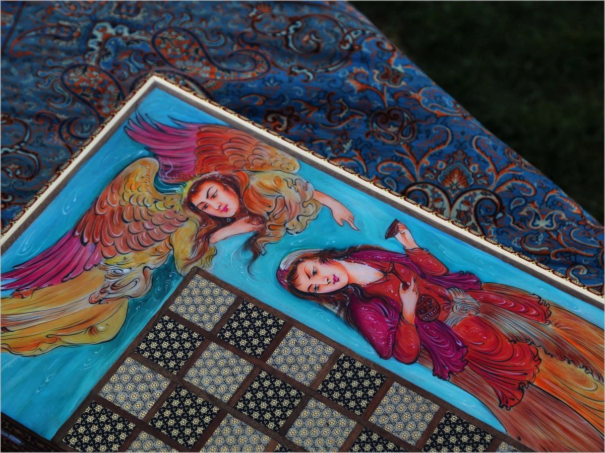 A beautiful, handcrafted Persian wooden backgammon, featuring intricate marquetry designs with a legendary scene of female Persian angles and a charming courting scene on both the outside and inside. Rich colors of crimson, green, blue, brown, and yellow bring the designs to life. Perfect for game rooms or collections