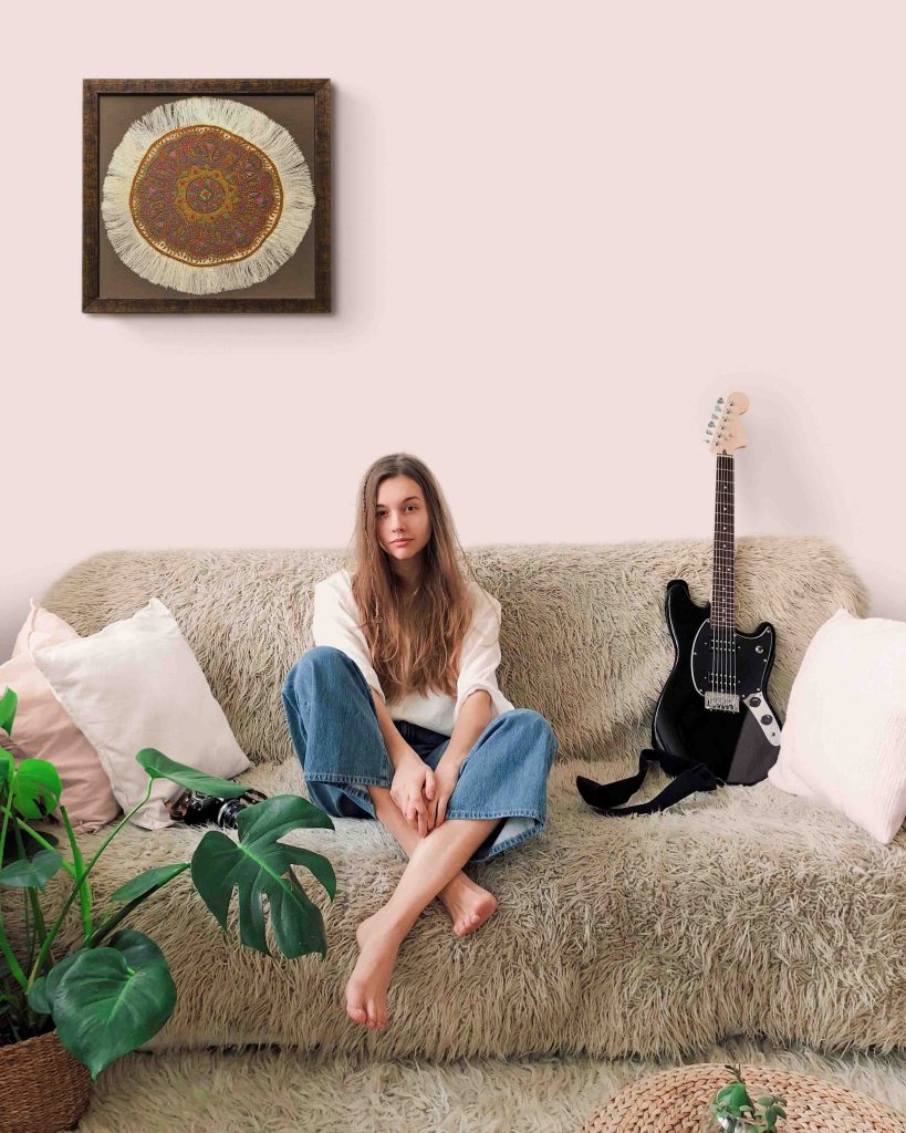 Circular Persian Pateh textile framed as a unique piece of wall art, featuring intricate embroidery and vibrant colors.