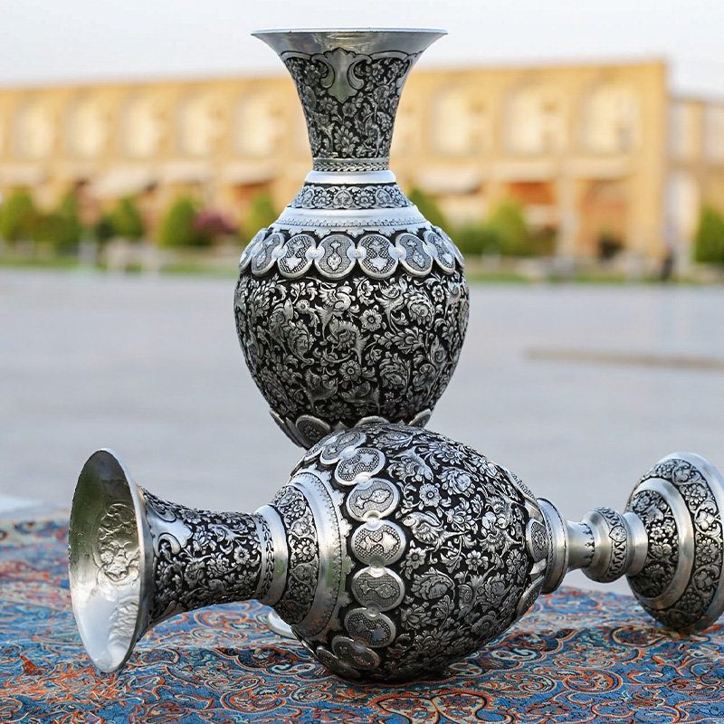 Pair of 40cm Persian Toreutics Vases featuring intricate Ghalam Zani engravings of Tulip design, birds, and human faces against a striking silver-black backdrop