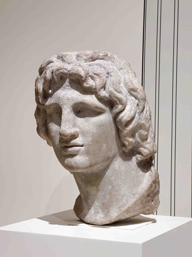 An image of Alexander the Great's idealized portrait, symbolizing his claim to divine status as the son of Zeus-Amon, used as a touchstone for rulers throughout the centuries aiming to legitimize their rule.