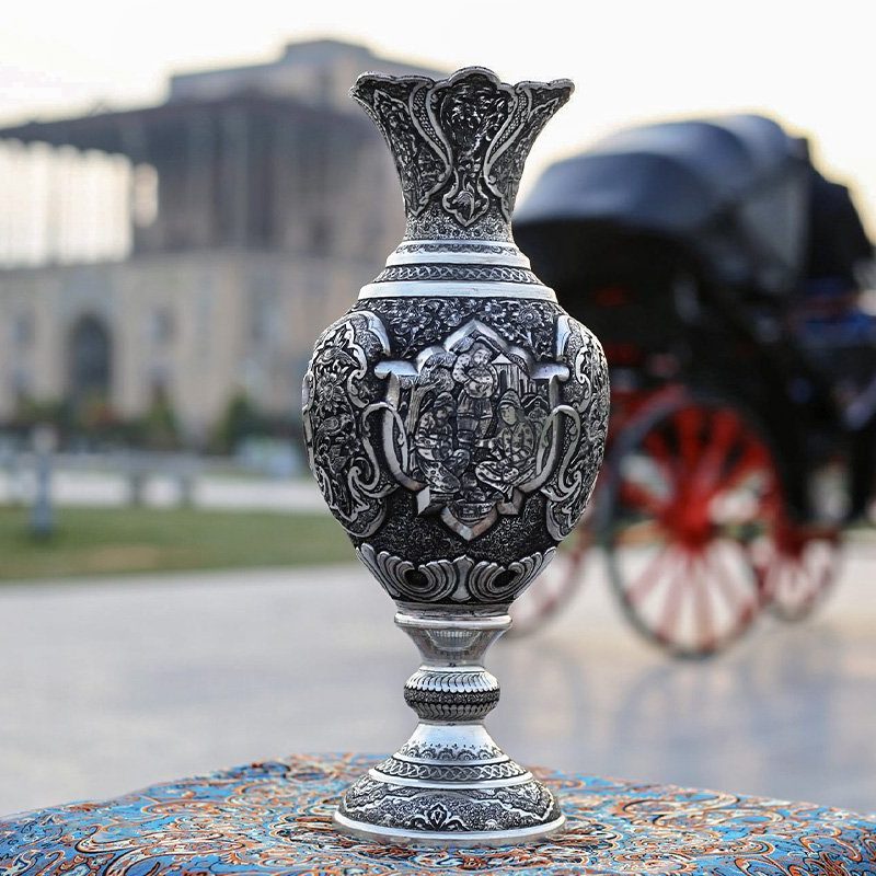 Two Persian Embossed Toreutics Vases made from high-quality copper, featuring intricate 3D designs of a traditional Persian gathering scene.