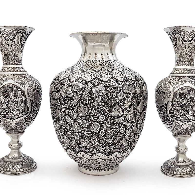 30 cm Persian Toreutics Vase made from Kerman copper, featuring Ghalam Zani engraving of Persian garden motifs in silver and black hues.