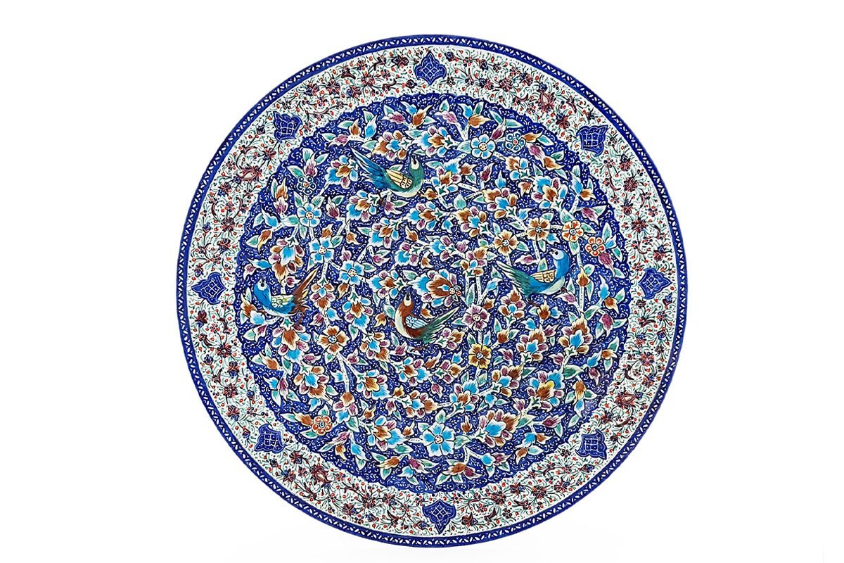 A Hand-crafted Persian Enamelled Plate by Craftestan, with a vibrant design of nightingales and flowers, reflective of Persian culture.