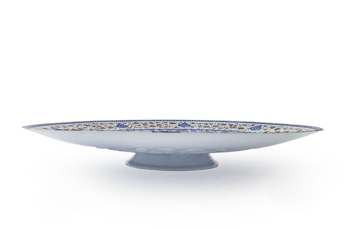 A Hand-crafted Persian Enamelled Plate by Craftestan, with a vibrant design of nightingales and flowers, reflective of Persian culture.