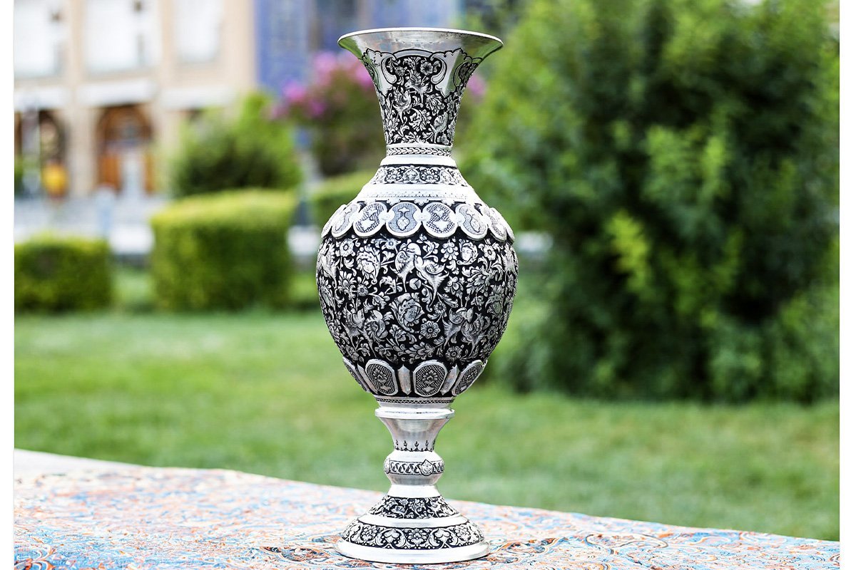 Pair of 40cm Persian Toreutics Vases featuring intricate Ghalam Zani engravings of Tulip design, birds, and human faces against a striking silver-black backdrop
