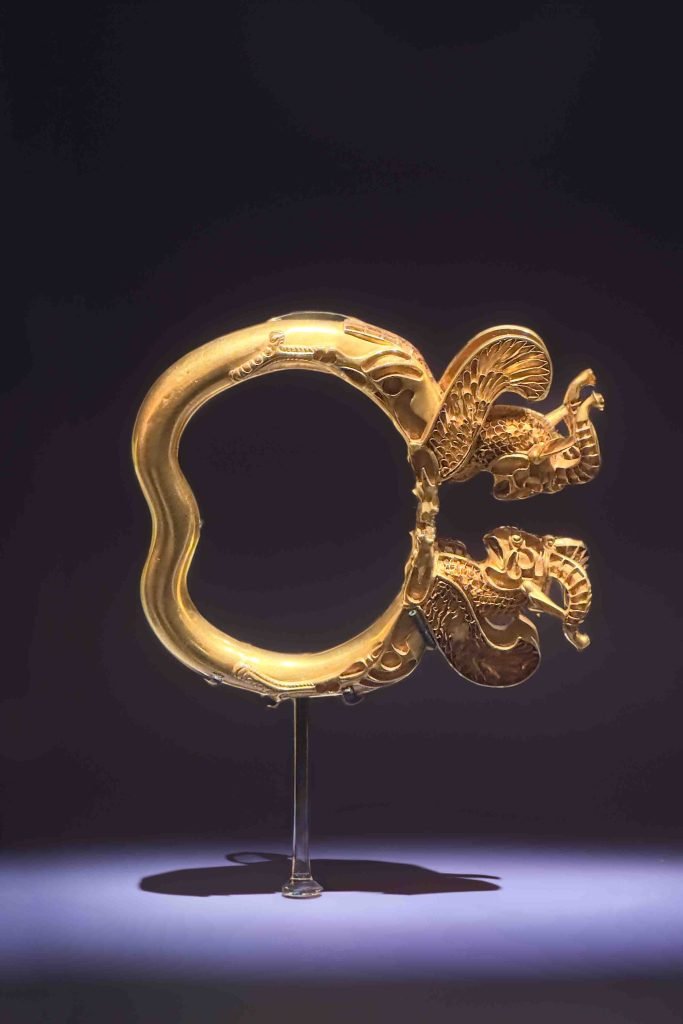 Gold armlet with designs of a leaping lion and griffin tips, dating back to ancient Persian times, found at Takht-i Kuwad, Tajikistan. ancient Persian jewellery