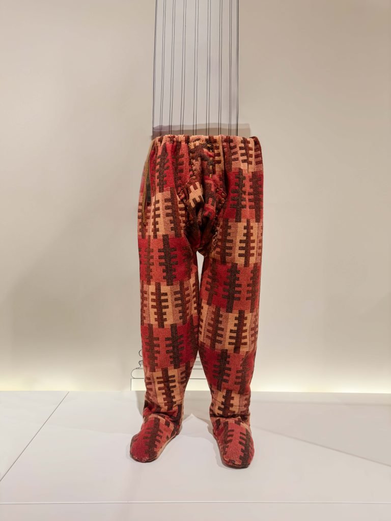 Ancient Persian Achaemenid riding trousers, intricately tailored with stitched crotch and folds, displayed in the British Museum