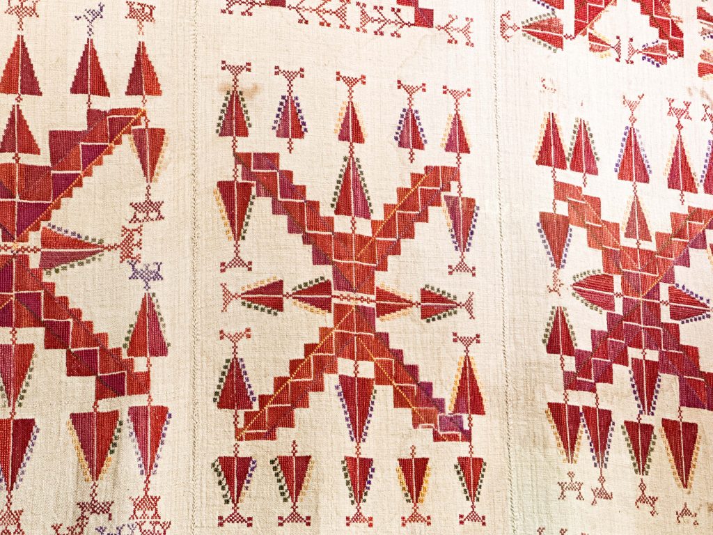 Detailed ghudfeh from Gaza, embroidered with V-shaped motifs, capturing the essence of Arabian clothing and Palestinian coastal and desert heritage.