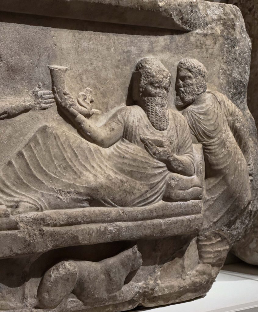 King Arbinas of Lycia, with a Persian rhyton and wine bowl, exemplifying the grandeur of Persian drinking customs.