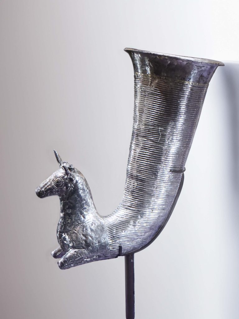 A meticulously crafted silver Gazelle Drinking Horn from the Achaemenid era, adorned with the detailed and elegant features of a gazelle, symbolizing the refined taste and luxurious lifestyles of ancient Persia.