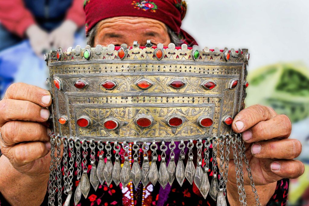 A Turkmen woman showcases the beauty of traditional jewellery that represents her cultural heritage and status.