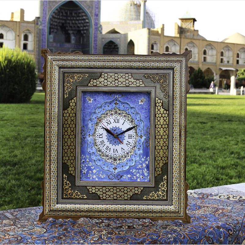 Handcrafted Persian wall clock with Mina-Kari enamel dial and Khatam-Kari inlay, made in Isfahan from wood, brass, and camel bone, measuring 55 cm x 50 cm.