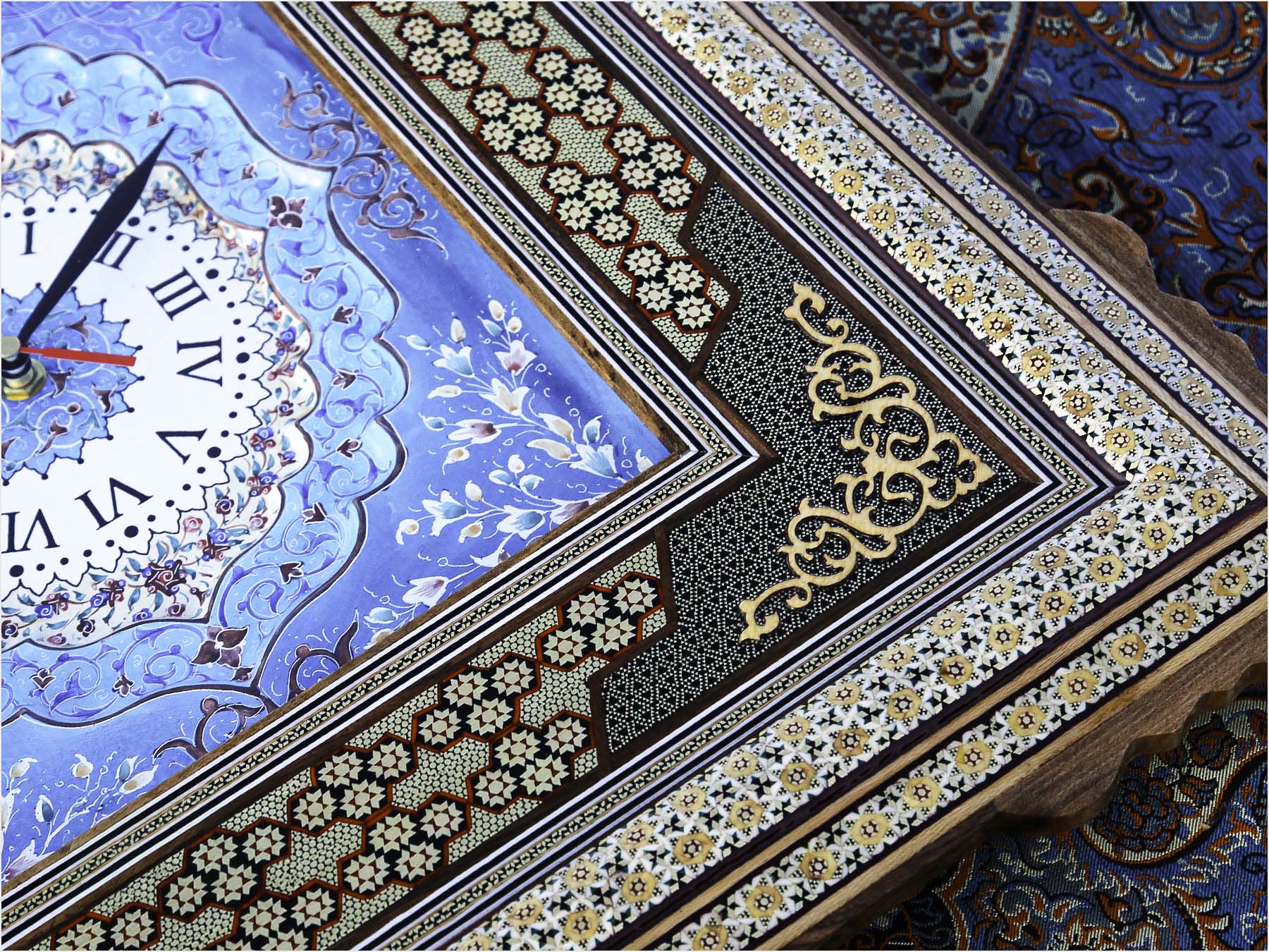 Handcrafted Persian wall clock with Mina-Kari enamel dial and Khatam-Kari inlay, made in Isfahan from wood, brass, and camel bone, measuring 55 cm x 50 cm.