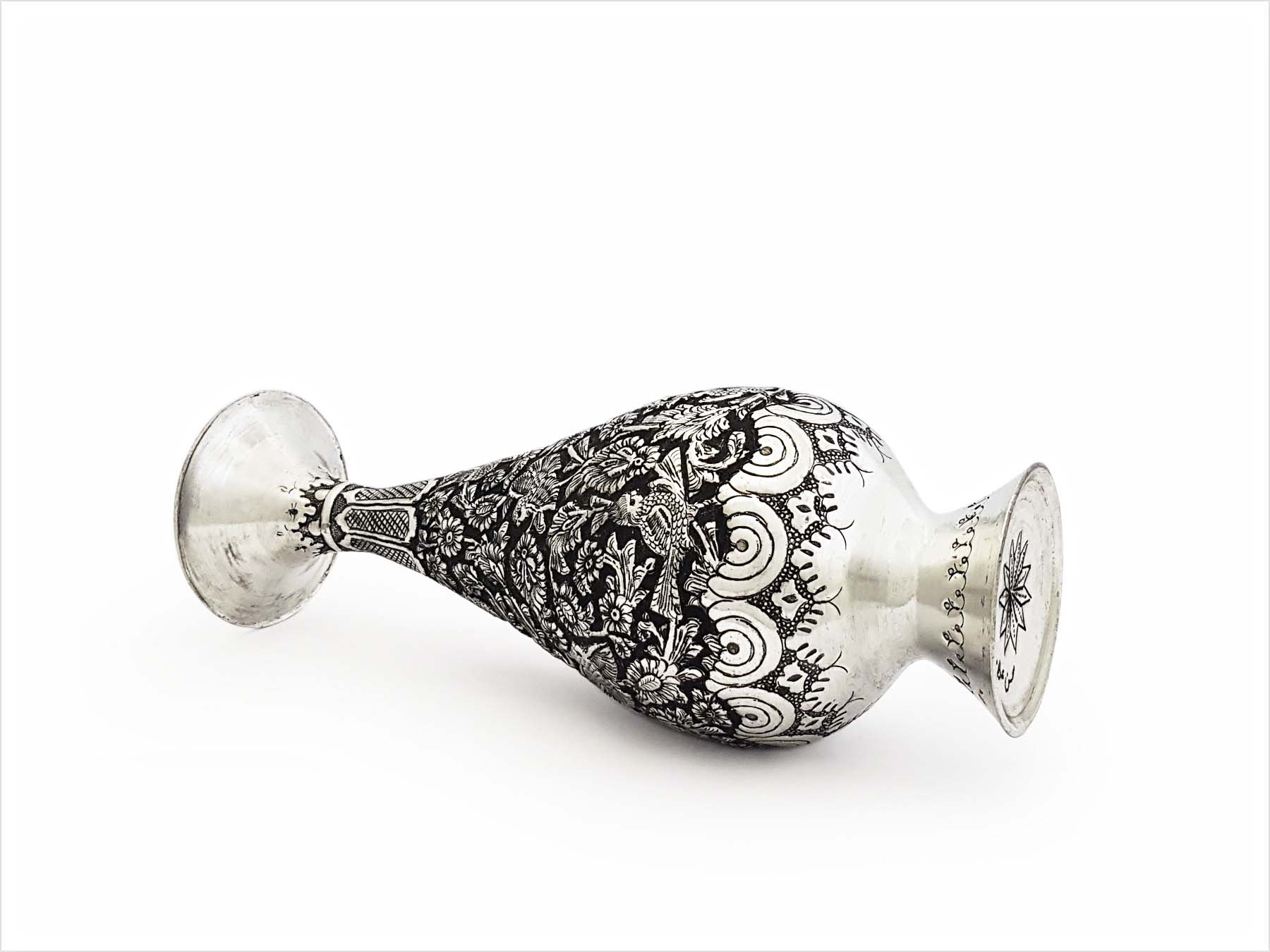 Handcrafted Persian Toreutics vase with floral engravings, made from copper and finished with tin and carbonic detailing. 25 cm height.