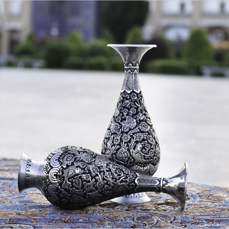 Handcrafted Persian Toreutics vase with floral engravings, made from copper and finished with tin and carbonic detailing. 25 cm height.