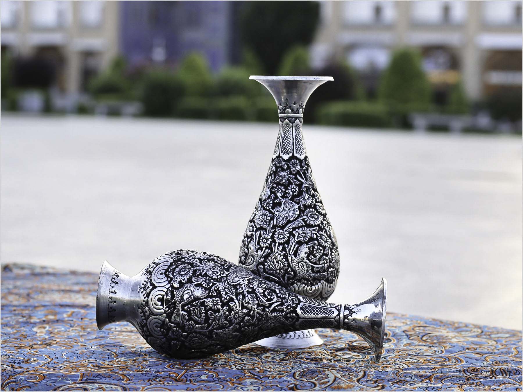 Handcrafted Persian Toreutics vase with floral engravings, made from copper and finished with tin and carbonic detailing. 25 cm height.