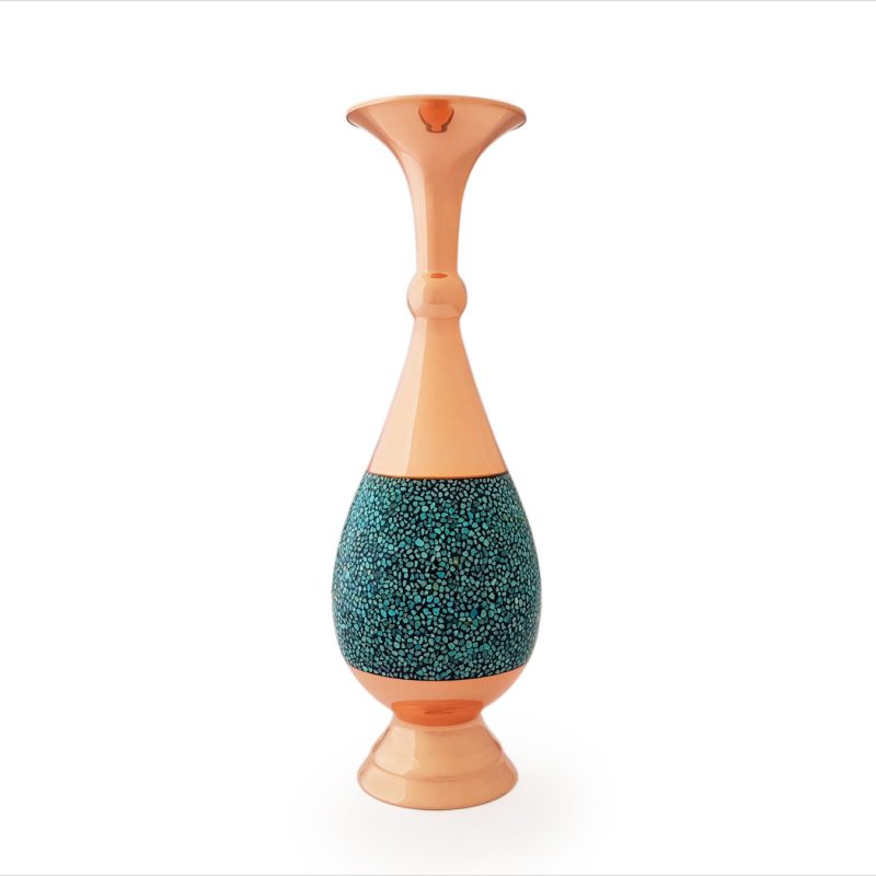 A 30 cm Sarahi Turquoise Inlay Vase crafted from Kerman copper, featuring an elongated design and adorned with hand-set Nishapur turquoise stones in a mosaic pattern.